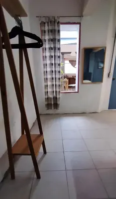 Una televisión o centro de entretenimiento en Casa cuatro