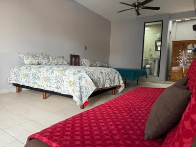 Cama o camas de una habitación en El Rinconcito Oaxaca - HiveNB
