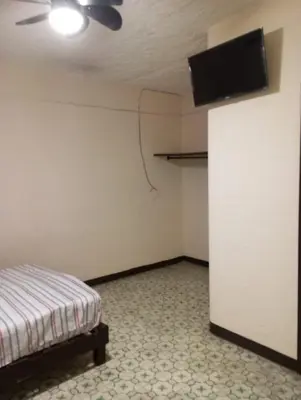 Cama o camas de una habitación en Hotel China Poblana