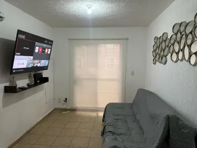 Una televisión o centro de entretenimiento en Casa en Acapulco los tulipanes