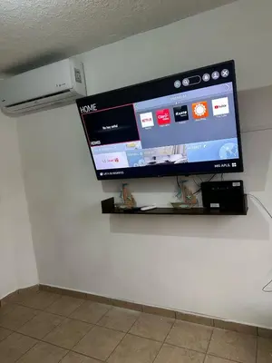 Una televisión o centro de entretenimiento en Casa en Acapulco los tulipanes