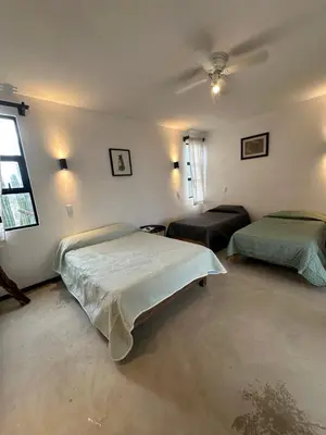 Cama o camas de una habitación en Punta Conejo Camila bungalows Surf Camp
