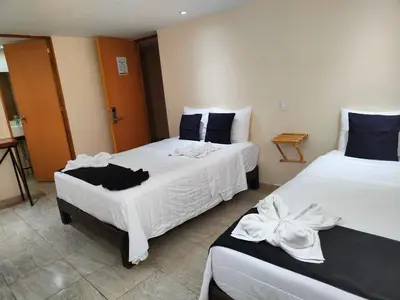 Cama o camas de una habitación en Ashly Loma Larga