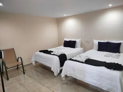 Cama o camas de una habitación en Ashly Loma Larga