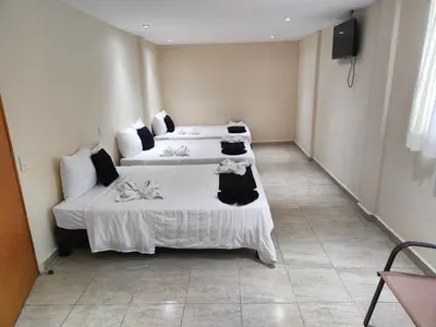 Cama o camas de una habitación en Ashly Loma Larga