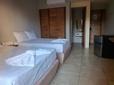 Cama o camas de una habitación en Tortuga Real Huatulco