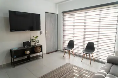 Una televisión o centro de entretenimiento en Departamento Acapulco Diamante