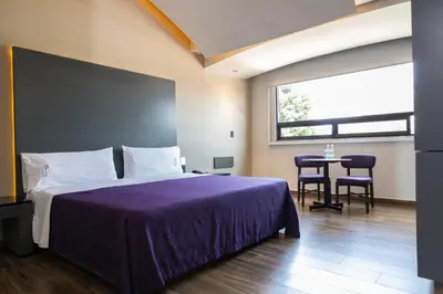 Cama o camas de una habitación en Hotel Aranjuez