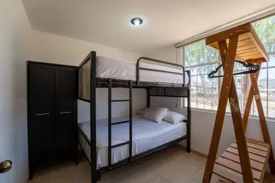 Cama o camas de una habitación en Departamento El Dorado