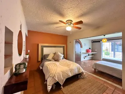 Cama o camas de una habitación en Casa Haru Alberca climatizada Jardín, asador y tombling, Capacidad 14 personas, 5 recámaras 5 baños 8 camas Estacionamiento para 4 autos Salida 5 pm