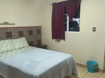 Cama o camas de una habitación en Servicios de Hospedaje