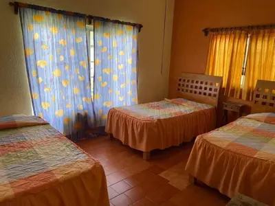Cama o camas de una habitación en Casa Bugambilia