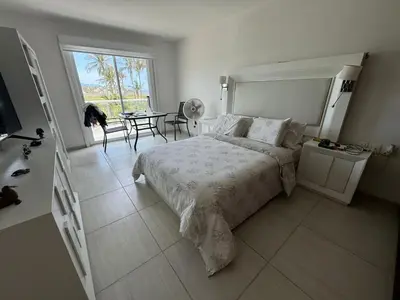 Cama o camas de una habitación en Casanar energía Sanadora frente al mar