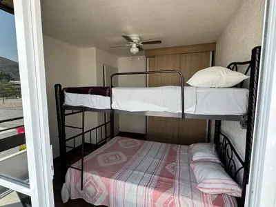 Cama o camas de una habitación en Residencial Quetzales
