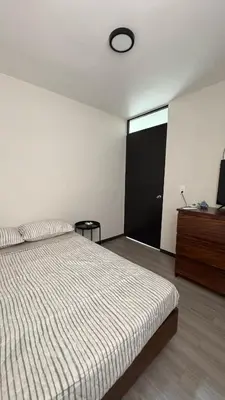 Cama o camas de una habitación en Departamento equipado a 10 minutos de la playa