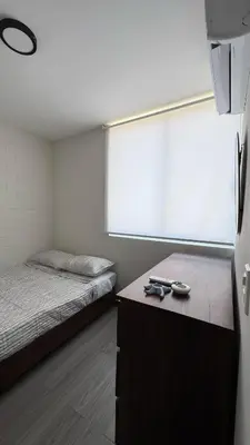 Cama o camas de una habitación en Departamento equipado a 10 minutos de la playa