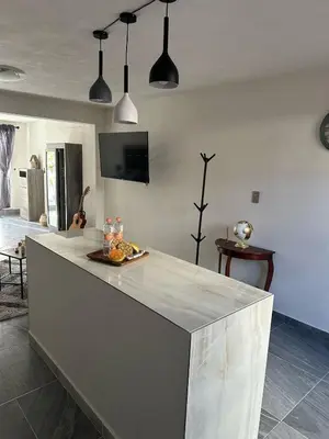 Una televisión o centro de entretenimiento en Casa Federico