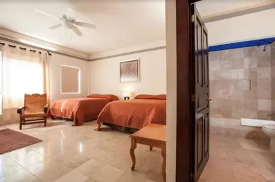 Cama o camas de una habitación en Orchidelirium Casa Hotel & Salud Estética