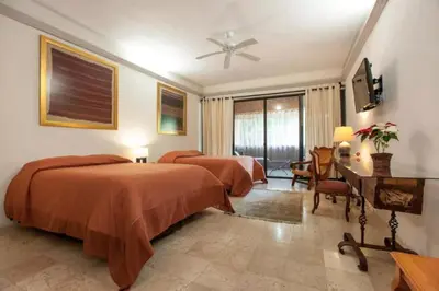 Cama o camas de una habitación en Orchidelirium Casa Hotel & Salud Estética