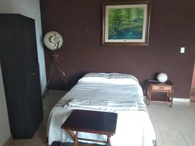 Cama o camas de una habitación en La Casa del Volcan