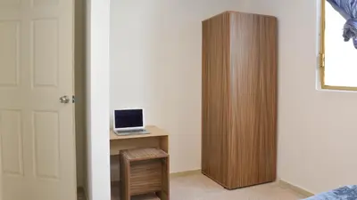 Una televisión o centro de entretenimiento en Casa Talento hostal hotel coliving