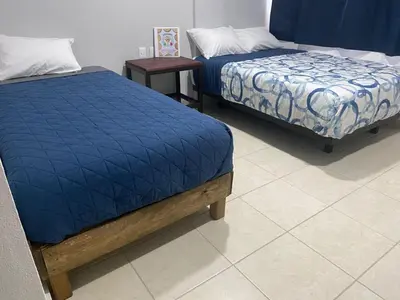 Cama o camas de una habitación en Hotel Sicarú