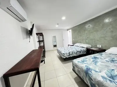 Cama o camas de una habitación en Hotel Sicarú