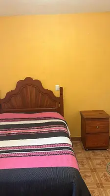 Cama o camas de una habitación en La casa de mi abuelita
