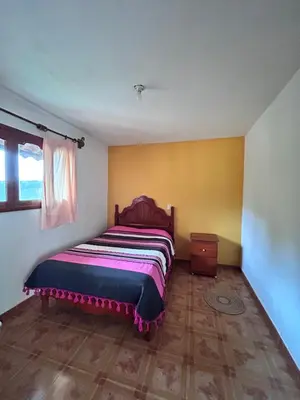 Cama o camas de una habitación en La casa de mi abuelita