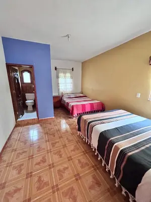 Cama o camas de una habitación en La casa de mi abuelita