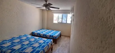 Cama o camas de una habitación en Departamento con alberca en costa azul, acapulco