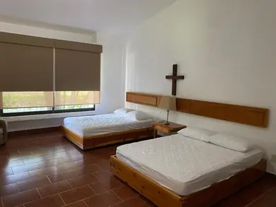 Cama o camas de una habitación en Vacation House Chamilpa