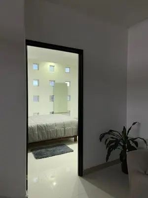 Cama o camas de una habitación en Habitación en departamento de lujo