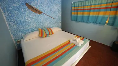 Cama o camas de una habitación en Zipoliteville - HOTEL NUDISTA