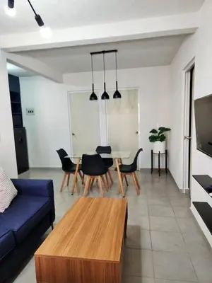 Una televisión o centro de entretenimiento en Departamento con alberca en área exclusiva Acapulco
