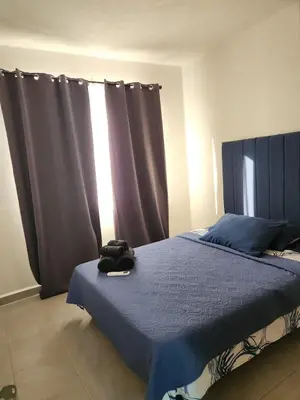 Cama o camas de una habitación en Departamento con alberca en área exclusiva Acapulco