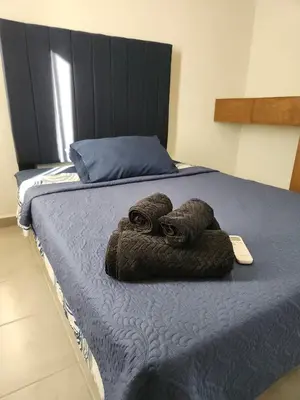 Cama o camas de una habitación en Departamento con alberca en área exclusiva Acapulco