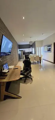 Una televisión o centro de entretenimiento en Loft Mi Alegria