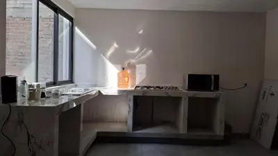 Una cocina o zona de cocina en departamento compartido Aeropuerto-GNP