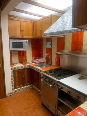 Una cocina o zona de cocina en Acogedor departamento