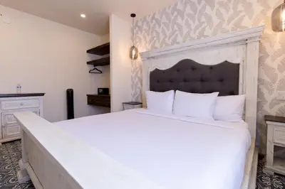 Cama o camas de una habitación en Bendito Capricho Hotel
