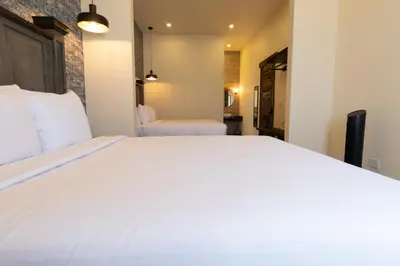 Cama o camas de una habitación en Bendito Capricho Hotel