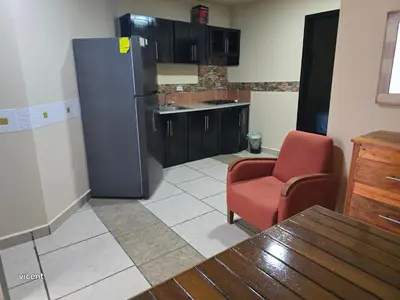 Una cocina o zona de cocina en bamboo blvd 1 recamara