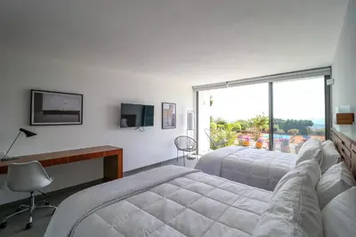 Cama o camas de una habitación en Villa Internacional Hotel & Club