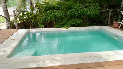 Piscina en o cerca de El nido en la playa con alberca y acceso directo a la bahia de Casa Pauline