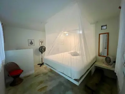 Cama o camas de una habitación en Casa con alberca y acceso directo a la playa