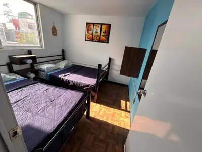 Cama o camas de una habitación en Hospedaje Casa Azul