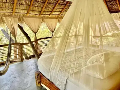 Cama o camas de una habitación en Habitaciones en casa De los árboles en la playa con alberca
