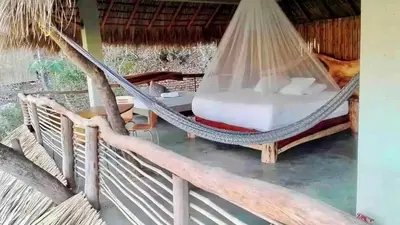 Cama o camas de una habitación en Habitaciones en casa De los árboles en la playa con alberca