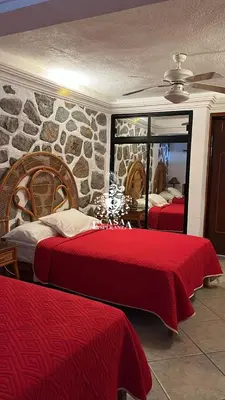 Cama o camas de una habitación en Casa Esperanza Acapulco